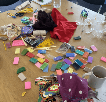 This photograph shows materials involved in the craft-elicitation interviews, including polymer clay, and sculpting tools